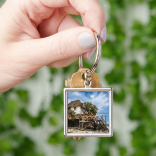 Picturesque house on a tropical coral outcrop key ring