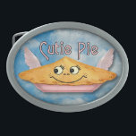 Pie in the Sky Retro Winged Cutie Belt Buckle<br><div class="desc">This cute belt buckle shows a pie in the sky on a blue cloudy sky background with a grunge effect added to make it look antique, alongside the words "Cutie Pie" in a retro style. The pie has a smiling face and light pink wings. It's made up of elements from...</div>