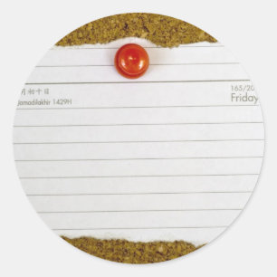 Piece of paper pegged to a cork board classic round sticker