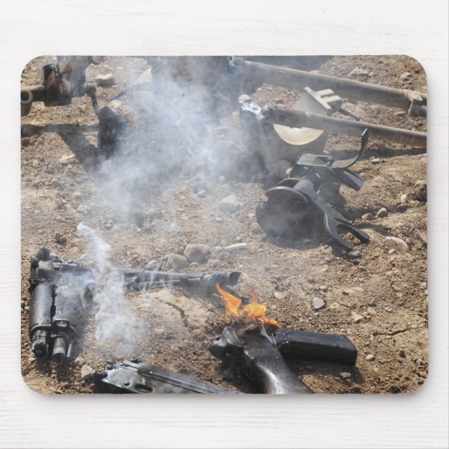 Pieces of enemy weapons lay out to cool off mouse mat (Front)