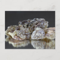 Pieces of natural frankincense resin on a mirror.