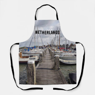 Pier with boats and yachts in Marken Netherlands A Apron