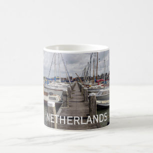 Pier with boats and yachts in Marken Netherlands Coffee Mug