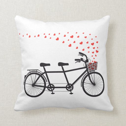 Image of Pillow with tandem bicycle and flying red hearts