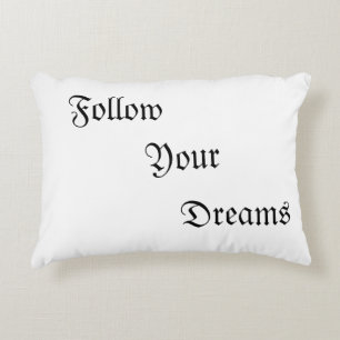 Pillows with wording "Follow Your Dreams"