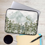 Pine Forest and Mountains Laptop Sleeve<br><div class="desc">Protect your laptop in style with our Pine Forest and Mountains Watercolor Laptop Sleeve. This design combines the beauty of nature with the practicality of a protective sleeve. Whether you're a nature lover or simply appreciate breathtaking artwork, this laptop sleeve is a perfect blend of functionality and artistic expression. Carry...</div>