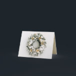 Pine Wreath Folded Christmas Holiday Card<br><div class="desc">Beautiful white and gold Christmas tree ornaments and flowers on a snow flocked pine wreath,  your personalised greeting and names are featured on a gold background on the inside of these folded holiday greeting cards. *ADD a photo on the top inside,  too.</div>