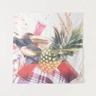 Pineapple beside phone and speaker tapestry