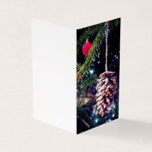 Pinecone and red bauble