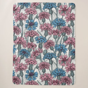 Pink and blue cornflowers, wild flowers on white sherpa blanket