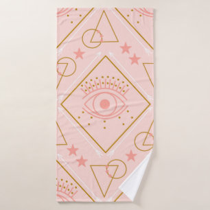 Pink and gold eyes and geometric elements in a sea bath towel