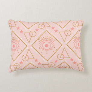 Pink and gold eyes and geometric elements in a sea decorative cushion