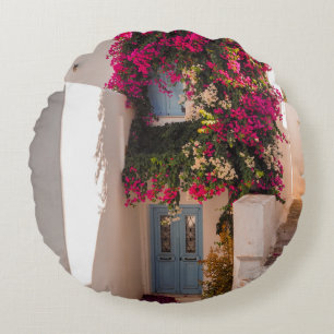 PINK AND GREEN PLANT ON WHITE CONCRETE WALL ROUND CUSHION