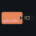 Pink and Orange Bold Typography Personalised Name  Luggage Tag<br><div class="desc">Travel in style with this personalised luggage tag featuring a modern minimalist design. The pink elegant serif name stands out against a soft orange background, creating a chic and timeless look. Perfect for frequent travelers, business professionals, students, and vacationers who want to easily identify their bags. The back includes space...</div>
