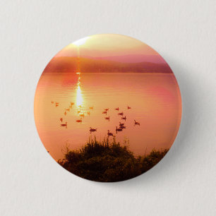 Pink and peach lake sunset 6 cm round badge