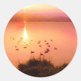 Pink and peach lake sunset classic round sticker