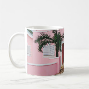 PINK AND WHITE CONCRETE HOUSE NEAR GREEN TREES UND COFFEE MUG