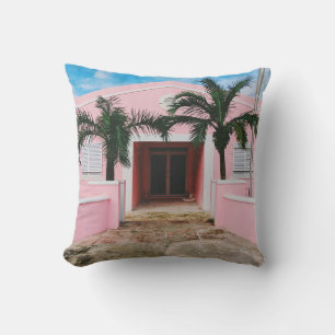 PINK AND WHITE CONCRETE HOUSE NEAR GREEN TREES UND CUSHION