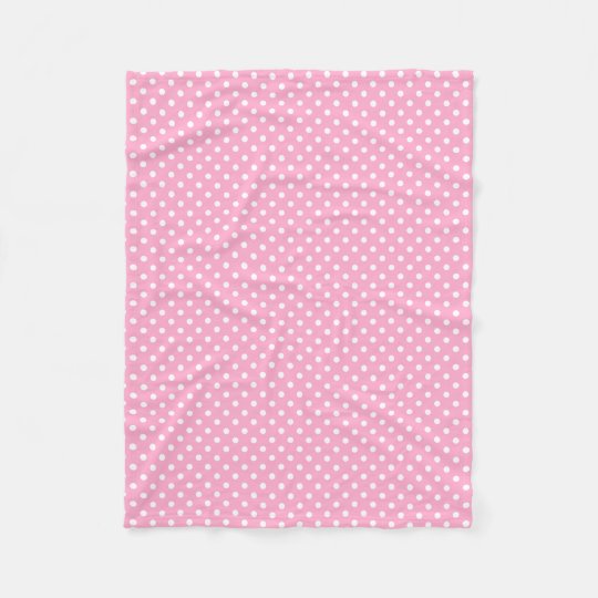 pink blanket with white polka dots