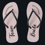 Pink Black Name Bride Bridal Party Bachelorette Flip Flops<br><div class="desc">A simple black and pink minimalist typography design for a bridal shower, bachelorette party or beach wedding. The text is customisable and can be personalised with your own name and bride slogan. For example, Bride Squad instead of Team Bride, Bride repeated on the left and right foot, or something else....</div>