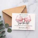 Pink bow cream Quinceanera Save the Date card<br><div class="desc">A modern and elegant Save the Date for a Quinceañera.   A soft cream,  beige coloured background,  decorated with a large pink bow. Personalise and add date,  place,  name and age.</div>