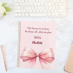 Pink bow inspirational quote 2026 planner<br><div class="desc">A soft blush pink background,  decorated with a large bow.  Inspiratiional,  motivational Quote: Live with intention.  The future is written by those who dare to plan.</div>
