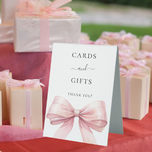 Pink bow white cards gifts sign
