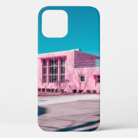Pink concrete building under clear blue sky