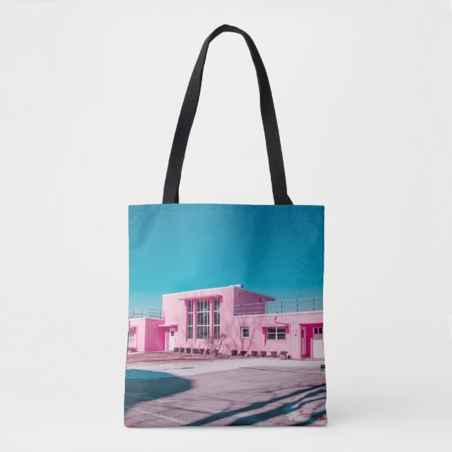Pink concrete building under clear blue sky tote bag (Front)