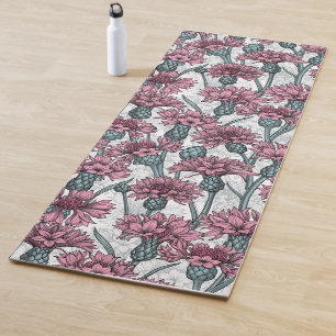 Pink cornflowers, wild flowers on white yoga mat