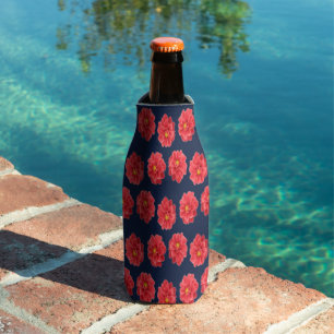 Pink dahlia flower on blue bottle cooler
