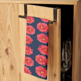 Pink dahlia flower on blue tea towel