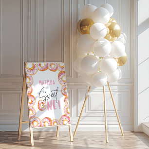 Pink donut 1st birthday party welcome sign