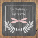 Pink Dragonfly Rustic Book Sticker<br><div class="desc">Create a stellar book tag for your kids with a Pink Dragonfly Rustic Book Sticker.  Sticker design features a vibrant dragonfly adorned with delicate foliage against a dark grey rustic wooden background.  Additional gift items available with this design as well.</div>