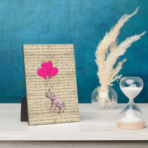 Pink elephant holding balloons plaque