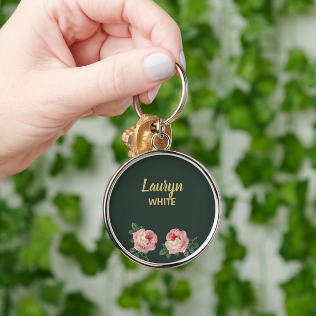 Pink flower and leaves on dark green key ring (Hand)