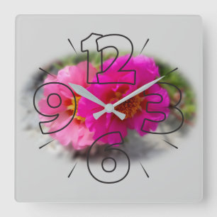 Pink flowers in the sun square wall clock