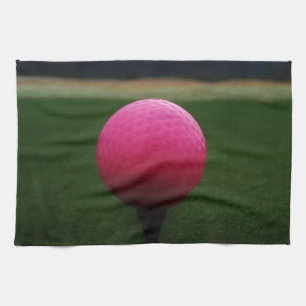 Pink Golf Ball on a mountain golf course Tea Towel