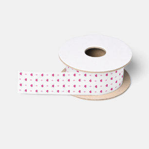 Pink hearts on white satin ribbon for wrapping.