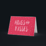 Pink Hugs and Kisses | Hearts | Valentine's Day Holiday Card<br><div class="desc">Pink card featuring scattered hearts with the words "Hugs and Kisses". This sweet greeting card is perfect for Valentine's Day or just to give to the ones you love. *Please note that the Zazzle Watermark that appears in the zoom preview will not appear on the final printed product © Rosewood...</div>
