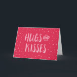 Pink Hugs and Kisses | Hearts | Valentine's Day Holiday Card<br><div class="desc">Pink card featuring scattered hearts with the words "Hugs and Kisses". This sweet greeting card is perfect for Valentine's Day or just to give to the ones you love. *Please note that the Zazzle Watermark that appears in the zoom preview will not appear on the final printed product © Rosewood...</div>