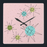 Pink Iconic Atomic Starbursts Wall Clock<br><div class="desc">This Pink Iconic Atomic Starbursts Square Acrylic Wall Clock pattern features iconic atomic starbursts. That’s right! The old school, First Lady Pink coloured background with gold speckles is the perfect backdrop for the vibrant turquoise, soothing celery, and kitschy pear green coloured circles. The spots of colour are sporadically placed in...</div>