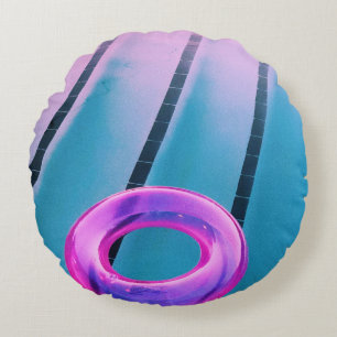 Pink inflatable ring on pool round cushion