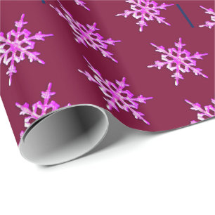 Pink iridescent snowflake on burgundy wrapping paper