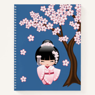 Pink Kimono Kawaii Kokeshi Doll on Blue Notebook