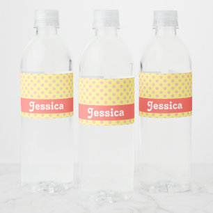 Pink polka dots on yellow water bottle label