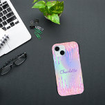 Pink purple holographic glitter drips name iPhone 15 case<br><div class="desc">A trendy holographic background with unicorn and rainbow pastel colours in pink,  purple,  rose gold,  mint green. Decorated with faux glitter drips in rose gold,  pink and purple. Personalise and add a name.   A bit of everyday glam to brighten up your day!</div>