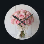 Pink Rose Bouquet Pearl Lace Romantic Round Clock<br><div class="desc">Delicate and dreamy bouquet of soft pastel pink roses wrapped in ivory lace and pearl accents. This gentle,  feminine composition radiates timeless romance,  elegance and quiet sophistication the perfect expression of tender love,  bridal grace and classic feminine beauty.</div>