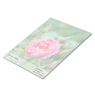 Pink rose flower and green leaves. notepad