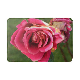 Pink rose in a garden bath mat